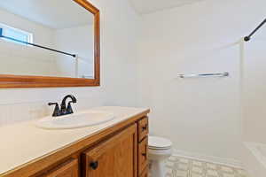 Bathroom with vanity and toilet