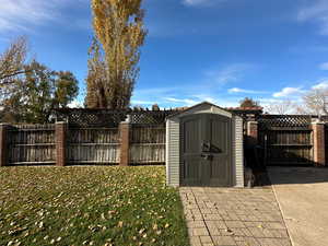 View of outdoor structure with a yard