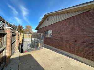 View of side of home with a patio