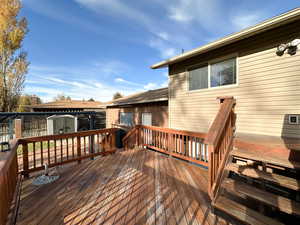 Deck featuring a shed