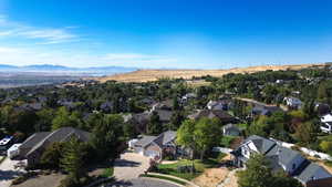 Birds eye view of property with a mountain view