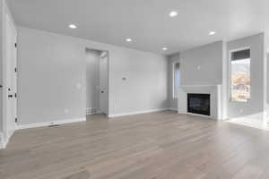 Unfurnished living room with light hardwood / wood-style flooring