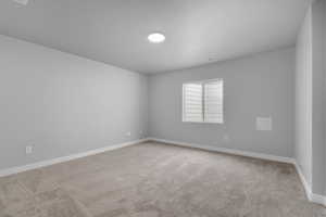 Empty room featuring carpet flooring