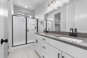 Bathroom with vanity and walk in shower