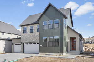 View of front of home featuring a garage