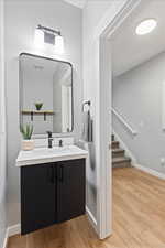 Bathroom featuring vanity and wood-type flooring