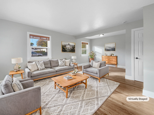 Living room with light wood-type flooring