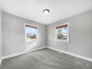 Spare room with carpet and plenty of natural light