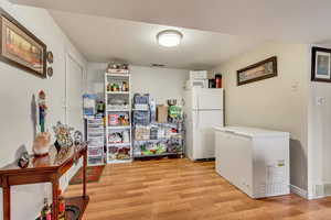 Washroom featuring light hardwood / wood-style floors