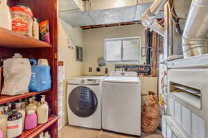 Laundry area featuring washing machine and clothes dryer