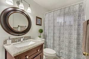 Bathroom with vanity and toilet