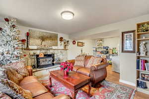 Living room with hardwood / wood-style flooring