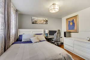 Bedroom featuring dark hardwood / wood-style flooring