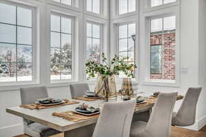 Dining room featuring hardwood / wood-style flooring and plenty of natural light