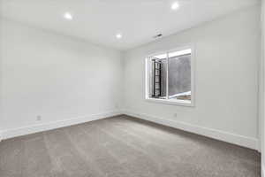 Empty room with carpet flooring