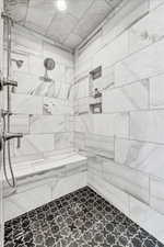 Bathroom featuring a tile shower