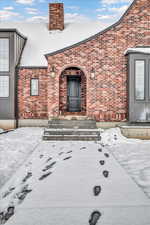 View of snow covered property entrance