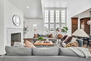 Living room featuring a premium fireplace and hardwood / wood-style floors