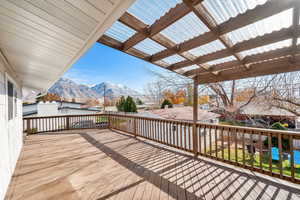 Wooden deck featuring a mountain view