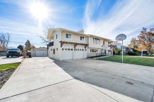 View of front of home with a garage and a front yard