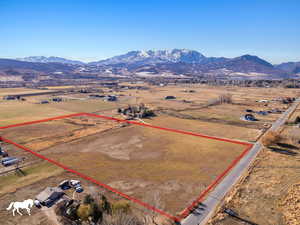 Birds eye view of property with a mountain view and a rural view