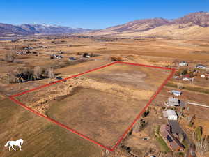 Birds eye view of property with a mountain view and a rural view