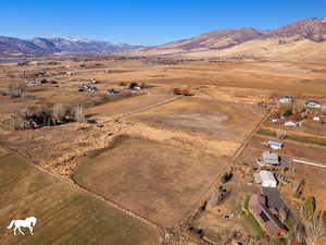 Birds eye view of property with a mountain view and a rural view