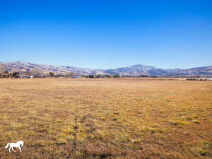 Property view of mountains with a rural view