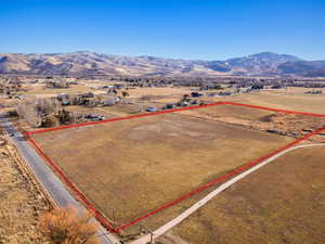 Birds eye view of property featuring a mountain view and a rural view