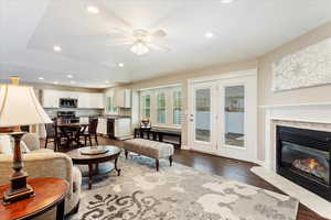 Kitchen/dining/great room with fireplace and french doors out to the covered patio