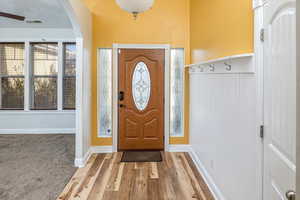 Entryway with hardwood / wood-style flooring