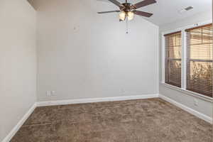 Empty room featuring carpet floors and ceiling fan