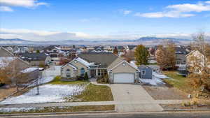 View of front facade featuring a mountain view and a garage