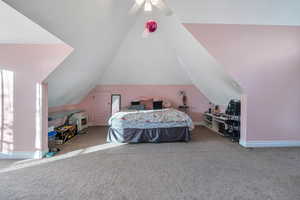 Upstairs bedroom has vaulted ceilings