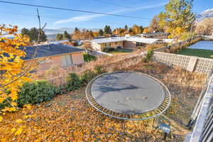 View of yard featuring a mountain view and a trampoline