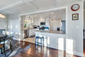 Kitchen has extra barstool seating