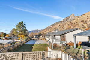 View of yard featuring a mountain view and a patio area