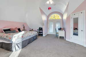 Upstairs bedroom has beautiful windows and vaulted ceilings