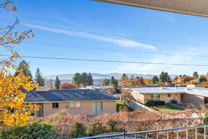 Rear view of property with a mountain view