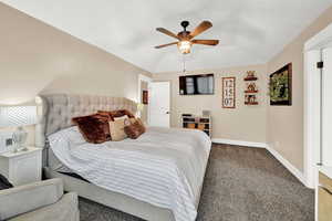 Bedroom featuring carpet flooring and ceiling fan