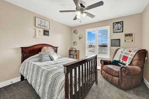 Bedroom featuring carpet flooring and ceiling fan