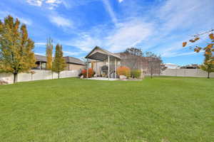 Exterior space featuring a lawn and a patio area