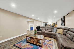 Living room with hardwood / wood-style flooring