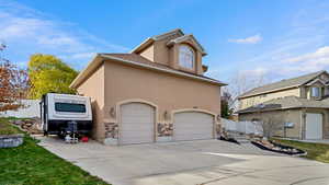 View of side of property featuring a garage