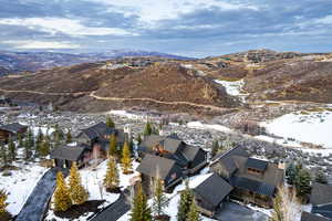 Snowy aerial view with a mountain view