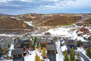 Snowy aerial view featuring a mountain view