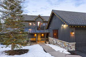 View of front of house with a balcony and a garage