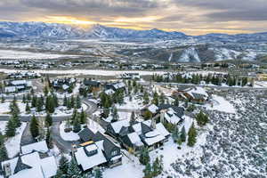 Snowy aerial view featuring a mountain view