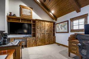 Office with lofted ceiling with beams, carpet, and wood ceiling