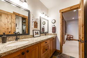 Bathroom with tile patterned flooring and vanity